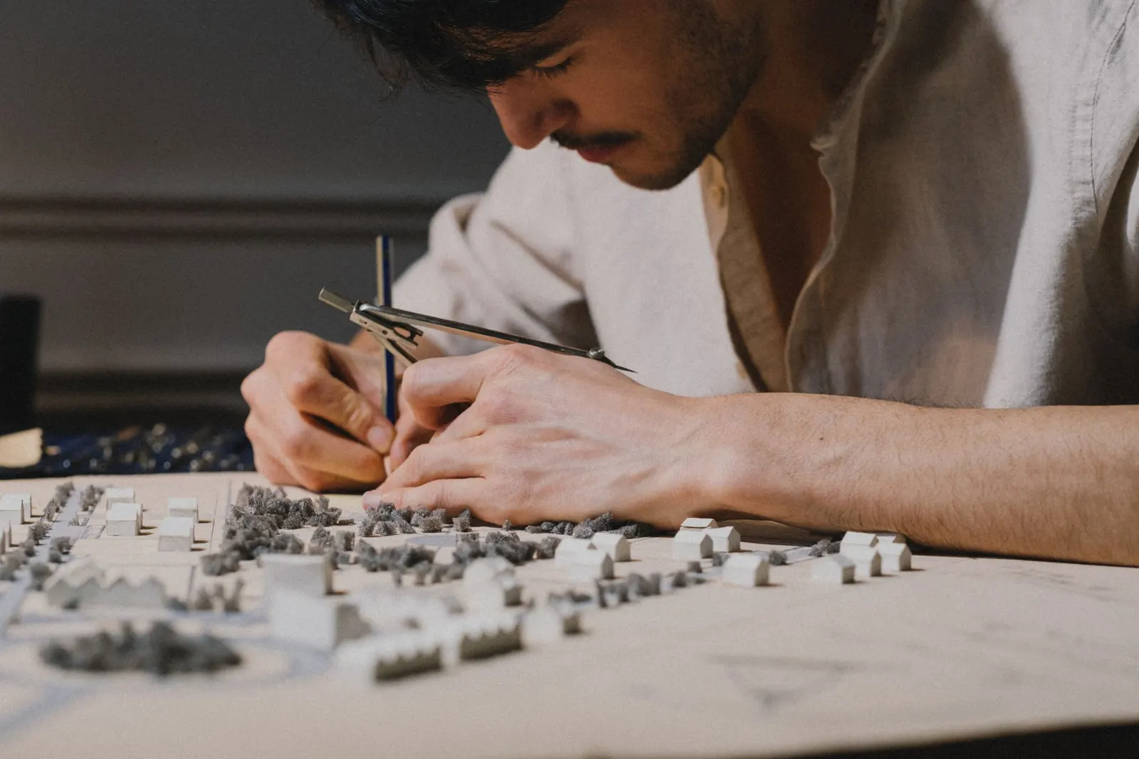 Architect working on a physical urban model